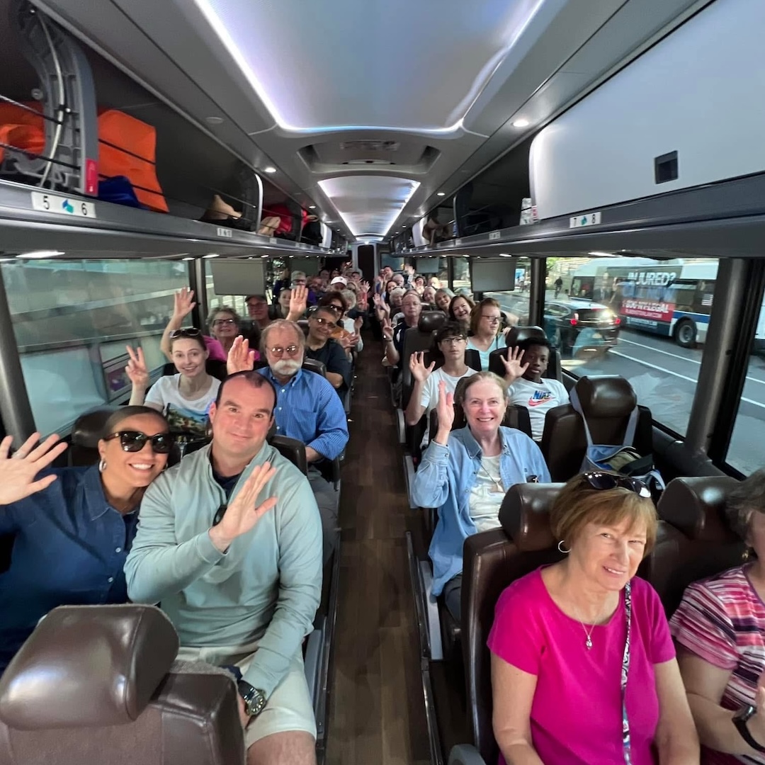 Group of happy adults on a bus